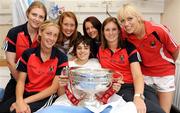 14 September 2009; Robert Styles from Knocklyon, Co. Dublin with Cork players, from left, Lucy Hawkes, Jenny Duffy, Rena Buckley, Sarah Hayes, Amanda O'Regan and Lynda O'Connell with the O'Duffy Cup during a visit to Our Lady's Hospital for Sick Chidren in Crumlin. Crumlin, Dublin. Photo by Sportsfile