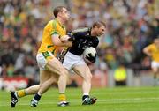 30 August 2009; Marc O Se, Kerry, is tackled by Nigel Crawford, Meath. GAA All-Ireland Senior Football Championship Semi-Final, Kerry v Meath, Croke Park, Dublin. Picture credit: Ray McManus / SPORTSFILE