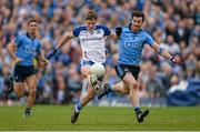 5 April 2015; Darren Hughes, Monaghan, solos the ball as he attempts to get way from the challenge of Michael Darragh Macauley, Dublin. Allianz Football League, Division 1, Round 7, Monaghan v Dublin. St Tiernach’s Park, Clones, Co. Monaghan. Picture credit: Brendan Moran / SPORTSFILE