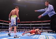 19 December 2015; Andy Lee, right, is knocked down in the third round by Billy Joe Saunders. WBO World Middleweight Title Fight, Andy Lee v Billy Joe Saunders. Manchester Arena, Manchester. Picture credit: Ramsey Cardy / SPORTSFILE