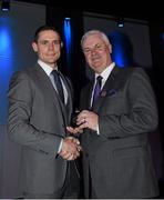 18 December 2015; Dublin captain Stephen Cluxton is presented with his All Ireland medal by Uachtarán Chumann Lúthchleas Aogán Ó Fearghail at the presentation of O'Byrne Cup, Allianz League, Leinster and All Ireland Championship medals at Croke Park, Dublin. Picture credit: Ray McManus / SPORTSFILE