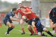 18 September 2009; Derry O'Connor, Munster, is tackled by Peter DuToit, left, and Colin Mallon, Leinster. U19 Interprovincial, Munster v Leinster, Thomond Park, Limerick. Picture credit: Diarmuid Greene / SPORTSFILE