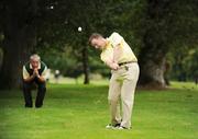 16 September 2009; Frank Ford, Oughterard Golf Club, Co. Galway, under the watchful eyes of his caddy Mike darcy, plays his second shot, over trees, to the 14th during the Bulmers Junior Cup Semi-Final. Bulmers Cups and Shields Finals 2009, Tullamore Golf Club, Brookfield, Tullamore, Co. Offaly. Picture credit: Ray McManus / SPORTSFILE