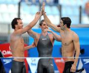 2 August 2009; Members of the USA team, from left, Aaron Peirsol, Eric Shanteau, and Michael Phelps celebrate after the men's 4x100m medley final. The USA won in a World Record time of 3:27.28. FINA World Swimming Championships Rome 2009, Foro Italico, Rome, Italy. Picture credit: Brian Lawless / SPORTSFILE