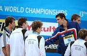 2 August 2009; USA's Michael Phelps shakes hands with the German swimmers, who finished in second place, after the men's 4x100m medley final. The USA won in a World Record time of 3:27.28. FINA World Swimming Championships Rome 2009, Foro Italico, Rome, Italy. Picture credit: Brian Lawless / SPORTSFILE