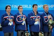 2 August 2009; The USA Men's 4 x 100m Medley Relay team, from left, Aaron Peirsol, Eric Shanteau, Michael Phelps and David Walters, on the podium after receiving their Gold medals. The USA won in a World Record time of 3:27.28. FINA World Swimming Championships Rome 2009, Foro Italico, Rome, Italy. Picture credit: Brian Lawless / SPORTSFILE