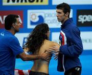 2 August 2009; Winner of the men's FINA Swimmer of the Championship Award Michael Phelps of the USA reacts as a fan is restrained after attempting to approach him. FINA World Swimming Championships Rome 2009, Foro Italico, Rome, Italy. Picture credit: Brian Lawless / SPORTSFILE