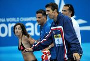2 August 2009; Winner of the men's FINA Swimmer of the Championship Award Michael Phelps of the USA reacts as a fan is restrained after attempting to approach him. FINA World Swimming Championships Rome 2009, Foro Italico, Rome, Italy. Picture credit: Brian Lawless / SPORTSFILE