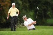 19 September 2009; Eddie McCormack, Galway Golf Club, under the watchful eyes of his West Waterford opponent Gary Hurley, plays from a bunker at the 17th hole during the Bulmers Senior Cup Final. Bulmers Cups and Shields Finals 2009, Tullamore Golf Club, Brookfield, Tullamore, Co. Offaly. Picture credit: Ray McManus / SPORTSFILE