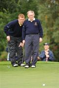 19 September 2009; Liam O'Gara, left, and his playing partner Dennis Corrigan, Nenagh Golf Club, line up a putt on the 12th green during the Bulmers Jimmy Bruen Shield Final. Bulmers Cups and Shields Finals 2009, Tullamore Golf Club, Brookfield, Tullamore, Co. Offaly. Picture credit: Ray McManus / SPORTSFILE