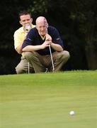 19 September 2009; Michael Corrigan, left, and his playing partner Jimmy Griffin, Nenagh Golf Club, line up a putt on the 12th green during the Bulmers Jimmy Bruen Shield Final. Bulmers Cups and Shields Finals 2009, Tullamore Golf Club, Brookfield, Tullamore, Co. Offaly. Picture credit: Ray McManus / SPORTSFILE