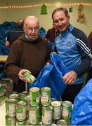 21 December 2015; Dublin manager Jim Gavin with Br. Kevin Crowley, as they help pack some 3,000 Christmas parcels for the homeless at the Capuchin Day Centre on Bow Street, Dublin. Picture credit: Ray McManus / SPORTSFILE