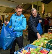 21 December 2015; Dublin footballer Paul Flynn and selector Jim Brogan as they help pack some 3,000 Christmas parcels for the homeless at the Capuchin Day Centre on Bow Street, Dublin. Picture credit: Ray McManus / SPORTSFILE