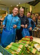 21 December 2015; Dublin footballer Paul Flynn, selector Jim Brogan and goalkeeper coach Davy Byrne as they help pack some 3,000 Christmas parcels for the homeless at the Capuchin Day Centre on Bow Street, Dublin. Picture credit: Ray McManus / SPORTSFILE