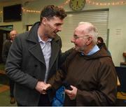 21 December 2015; Dublin footballer Paddy Andrews with Br. Kevin Crowley as they help pack some 3,000 Christmas parcels for the homeless at the Capuchin Day Centre on Bow Street, Dublin. Picture credit: Ray McManus / SPORTSFILE
