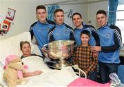 25 December 2015; Dublin footballers Brian Fenton, Eoin Culligan, Cormac Costello, captain Stephen Cluxton with Jill Cooper, from Atrane, Dublin, and her grandson Jamie, age 8, when they and the Sam Maguire visited patients of Beaumount Hospital on Christmas Day. Beaumont Hospital, Beaumont Rd, Dublin.  Picture credit: Ray McManus / SPORTSFILE