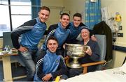 25 December 2015; Dublin footballers Eoin Culligan, captain Stephen Cluxton, Brian Fenton and Cormac Costello with Sean Kavanagh, from Walkinstown, Dublin, when they and the Sam Maguire visited patients of Beaumount Hospital on Christmas Day. Mr. Kavanagh has attended every All-Ireland, hurling and football, since 1942 and has been a steward for more than 50 years in Croke Park. Beaumont Hospital, Beaumont Rd, Dublin.  Picture credit: Ray McManus / SPORTSFILE