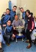25 December 2015; Dublin footballers Cormac Costello, Brian Fenton, Eoin Culligan and captain Stephen Cluxton with Denis Byrne, and his granddaughter Tallulah, from Fairview, Dublin, when they and the Sam Maguire visited patients of Beaumount Hospital on Christmas Day. Mr Byrne won an Intermediate Dublin Championship medal with St Joseph's in 1959. Beaumont Hospital, Beaumont Rd, Dublin.  Picture credit: Ray McManus / SPORTSFILE