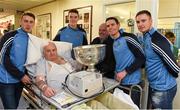 25 December 2015; Dublin footballers Cormac Costello, Brian Fenton, captain Stephen Cluxton and Eoin Culligan with Jim Morgan and son-in-law Noel Gallagher when they and the Sam Maguire visited patients of Beaumount Hospital on Christmas Day. Beaumont Hospital, Beaumont Rd, Dublin.  Picture credit: Ray McManus / SPORTSFILE