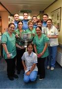 25 December 2015; Dublin footballers Eoin Culligan, Brian Fenton, captain Stephen Cluxton and Cormac Costello with staff members Rowena Adriano, Wendy Costello, Toni Geoghegan, Juliet Ilumin, Olivia Joyce, Lucy McCormack and Maria Mabingnay when they and the Sam Maguire visited patients of Beaumount Hospital on Christmas Day. Beaumont Hospital, Beaumont Rd, Dublin.  Picture credit: Ray McManus / SPORTSFILE