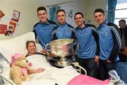 25 December 2015; Dublin footballers Brian Fenton, Eoin Culligan, Cormac Costello, captain Stephen Cluxton with Jill Cooper, from Atrane, Dublin, when they and the Sam Maguire visited patients of Beaumount Hospital on Christmas day. Beaumont Hospital, Beaumont Rd, Dublin.  Picture credit: Ray McManus / SPORTSFILE