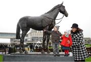 26 December 2015; Racegoers Elaine Platt with her children, Whesley and Amelia standing with the statue of Snowfairy at the races. Leopardstown Christmas Racing Festival, Leopardstown Racecourse, Dublin. Picture credit: Cody Glenn / SPORTSFILE