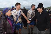 26 December 2015; Paul O'Donoghue, St Mary's, in the company of his grandmother Mary Daly, is congratulated by former Kerry and St Mary's footballer Ned Fitzgerald. South Kerry Senior Football Championship Final, St Mary's v Waterville. Páirc Chill Imeallach, Portmagee, Co. Kerry. Picture credit: Stephen McCarthy / SPORTSFILE