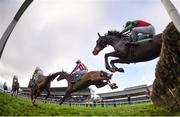 27 December 2015; A general view of horses jumping the last fence during the first lap of the Paddy Power 'Download Our New iPhone App' 3-Y-O Maiden Hurdle. Leopardstown Christmas Racing Festival, Leopardstown Racecourse, Dublin. Photo by Sportsfile