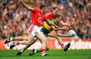 20 September 2009; Killian Young, Kerry, in action against Noel O'Leary, left, and Alan O'Connor, Cork. GAA Football All-Ireland Senior Championship Final, Kerry v Cork, Croke Park, Dublin. Picture credit: Stephen McCarthy / SPORTSFILE