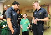 21 September 2009; Kerry's Tadhg Kennelly, left, and Tommy Walsh with Adam Sheridan,  age 11, from Dublin, during a visit to Our Lady's Hospital for Sick Chidren in Crumlin. Crumlin, Co. Dublin. Picture credit: Pat Murphy / SPORTSFILE