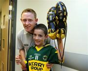 21 September 2009; Kerry's Colm Cooper with Jamie McVeigh, from Listowel, Co. Kerry, who is a cousin of Tadhg Kennelly, during a visit to Our Lady's Hospital for Sick Chidren in Crumlin. Crumlin, Co. Dublin. Picture credit: Pat Murphy / SPORTSFILE