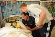 21 September 2009; Kerry's Tadhg Kennelly with his cousin Vincent McVeigh and team-mate Colm Cooper during a visit to Our Lady's Hospital for Sick Chidren in Crumlin. Crumlin, Co. Dublin. Picture credit: Pat Murphy / SPORTSFILE