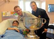 21 September 2009; Kerry's Colm Cooper and Darran O'Sullivan, right, with Sam Blennerhassett, from Sandycove, Dublin, and the Sam Maguire Cup during a visit to Our Lady's Hospital for Sick Chidren in Crumlin. Crumlin, Co. Dublin. Picture credit: Pat Murphy / SPORTSFILE