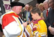 22 September 2009; Ireland rugby head coach Declan Kidney signs an autograph, for 10-year-old Luke O'Brien May from Grange, Co. Limerick, after receiving his honorary doctorate of science from the University of Limerick. University Concert Hall, University of Limerick, Limerick. Picture credit: Diarmuid Greene / SPORTSFILE