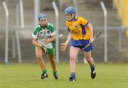 18 July 2009; Dee Corcoran, Clare, in action against Katie Campbell, Limerick. Gala Senior Camogie Championship, Group 2, Round 3, Clare v Limerick, Cusack Park, Ennis, Co. Clare. Picture credit: Diarmuid Greene / SPORTSFILE