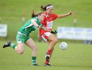 29 August 2009; Catherine Page, Louth, in action against Sandra Larkin, Limerick. TG4 All-Ireland Ladies Football Junior Championship Semi-Final, Limerick v Louth, Crettyard, Co. Laois. Picture credit: Matt Browne / SPORTSFILE