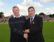 19 July 2009; Tyrone Jubilee Team member Eugene Bradley, receives a presentation from Ulster GAA President, Tom Daly, right, at half time in the GAA Football Ulster Senior Championship Final, Tyrone v Antrim, St Tighearnach's Park, Clones, Co. Monaghan. Picture credit: Oliver McVeigh / SPORTSFILE