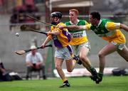 18 June 2000; Chris McGrath of Wexford in action against Simon Whelahan and Kevin Kinahan of Offaly during the Guinness Leinster Senior Hurling Championship Semi-Final match between Offaly and Wexford at Croke Park in Dublin. Photo by Aoife Rice/Sportsfile