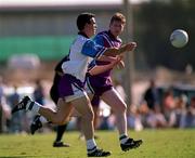 26 January 2001; Padraic Joyce of the 2000 Eircell All Stars in action against Kevin Cahill of the 1999 Eircell All Stars during the Eircell GAA All Stars Exibition game at Dubai Rugby Ground in Dubai, United Arab Emirates. Photo by Ray McManus/Sportsfile