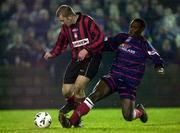 3 February 2001; Charles Livingstone Mbabazi of St Patrick's Athletic tackles Vinny Perth of Longford Town during the Harp Lager FAI Cup Third Round match between Longford Town and St Patrick's Athletic at Flancare Park in Longford. Photo by David Maher/Sportsfile