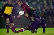 3 February 2001; Vinny Perth of Longford Town is tackled by Charles Livingstone Mbabazi of St Patrick's Athletic during the Harp Lager FAI Cup Third Round match between Longford Town and St Patrick's Athletic at Flancare Park in Longford. Photo by David Maher/Sportsfile