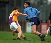 4 February 2001; Paul Casey of Dublin is tackled by JJ Doyle of Wexford during the Leinster U21 Football Championship First Round match between Dublin and Wexford at Parnell Park in Dublin. Photo by Aoife Rice/Sportsfile