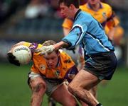 4 February 2001; Barry Byrne of Wexford is tackled by Barry Cahill of Dublin during the Leinster U21 Football Championship First Round match between Dublin and Wexford at Parnell Park in Dublin. Photo by Aoife Rice/Sportsfile