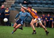 4 February 2001; Ronnie Carroll of Dublin is tackled by David Murphy of Wexford during the Leinster U21 Football Championship First Round match between Dublin and Wexford at Parnell Park in Dublin. Photo by Aoife Rice/Sportsfile