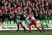 28 January 2001; Alan Quinlan of Munster is tackled by Stuart Legg of Biarritz during the Heineken Cup Quarter-Final match between Munster and Biarritz at Thomond Park in Limerick. Photo by Ray Lohan/Sportsfile