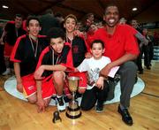 8 February 2001; St Fintan's Jerome Westbrooks celebrates with his sons, from left, Michael, Aaron, Isaac, who were all on the team and Eric following their side's third final win in a row after the Bank of Ireland Schools Cup Boys A Final match between St Fintan's in Sutton, Dublin and North Mon in Cork, at the National Bastetball Arena in Tallaght, Dublin. Photo by Brendan Moran/Sportsfile
