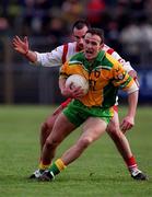 11 February 2001; James Gallagher of Donegal is tackled by Declan McCrossan of Tyrone during the Allianz National Football League Division 1B match between Tyrone and Donegal at Healy Park in Omagh, Tyrone. Photo by Damien Eagers/Sportsfile