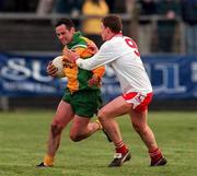 11 February 2001; Shane Carr of Donegal is tackled by Cormac McAnallen of Tyrone during the Allianz National Football League Division 1B match between Tyrone and Donegal at Healy Park in Omagh, Tyrone. Photo by Damien Eagers/Sportsfile