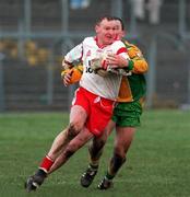 11 February 2001; Chris Lawn of Tyrone is tackled by Adrian Sweeney of Donegal during the Allianz National Football League Division 1B match between Tyrone and Donegal at Healy Park in Omagh, Tyrone. Photo by Damien Eagers/Sportsfile