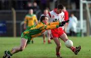 11 February 2001; Ciaran Gourley of Tyrone in action against Andrew Gallagher of Donegal during the Allianz National Football League Division 1B match between Tyrone and Donegal at Healy Park in Omagh, Tyrone. Photo by Damien Eagers/Sportsfile